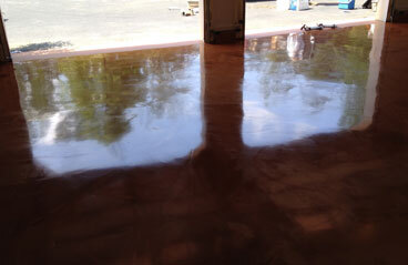 Metallic Garage Floor This image shows a garage floor with metallic epoxy that is brown in color.