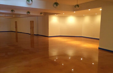 Accident Prone Flooring This image show a commercial floor with epoxy that is brown in color.