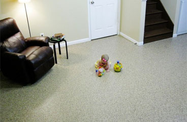 This image shows a living room with a baby playing on the floor.