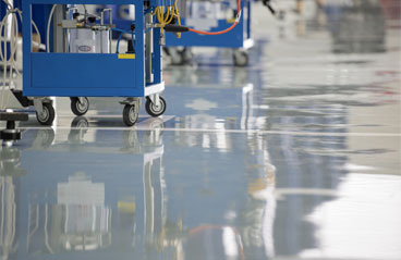 This image shows an industrial plant with gray epoxy floors.