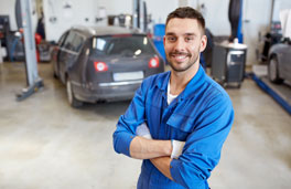 This shows a mechanic smiling.